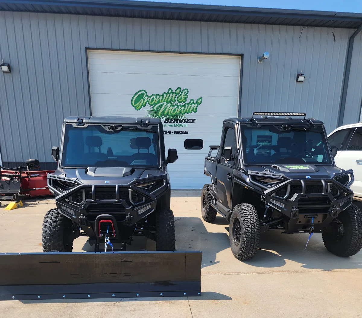 Growin and Mowin snow removal equipment outside the Sioux Falls shop